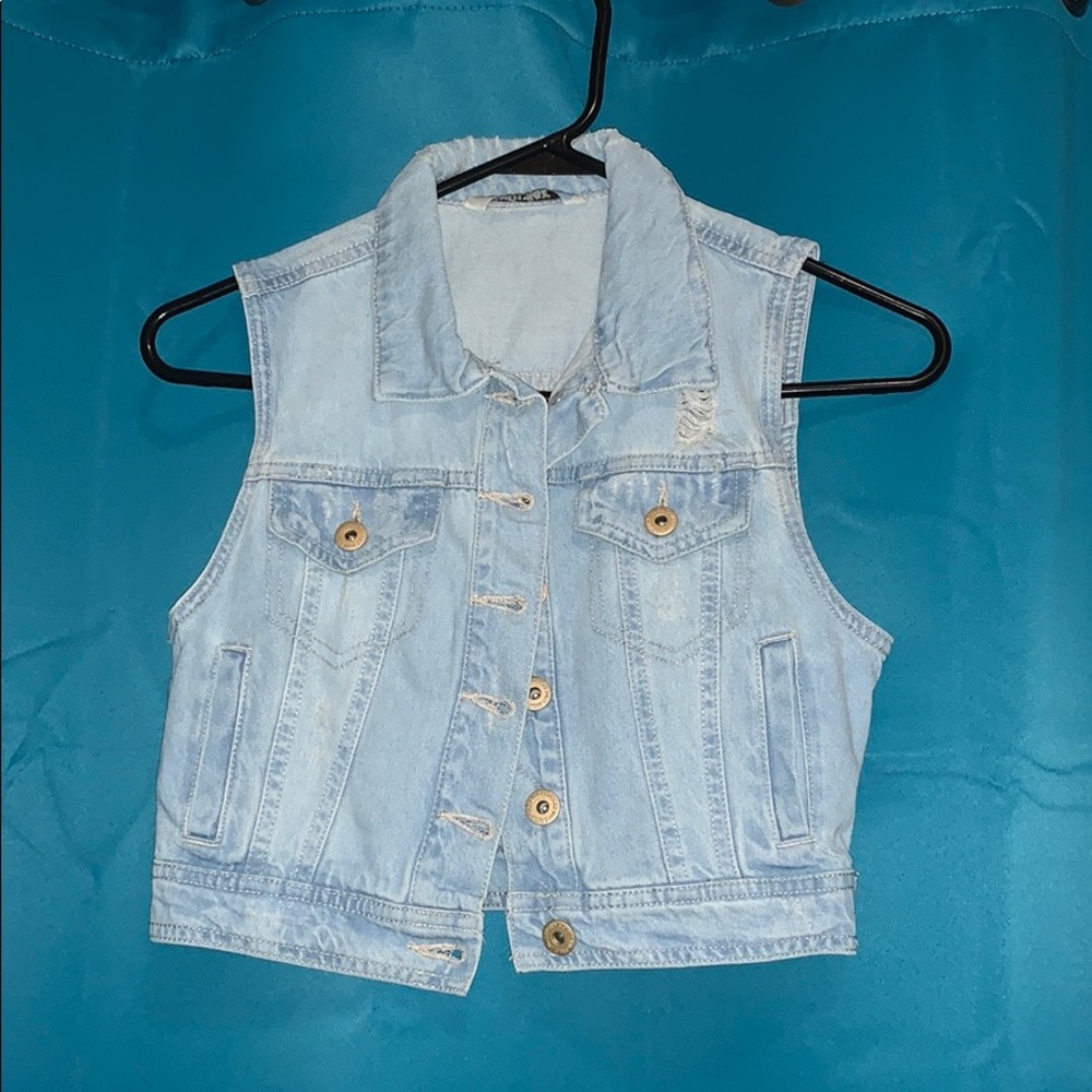 “Distressed” denim vest
